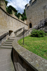 Fototapeta na wymiar Climbers on the stone wall to the tower