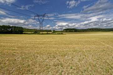 Harvested wheat field below the tower