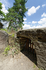 Wooden door under the rock