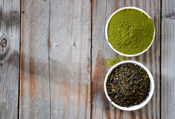 Dried tea with Green tea powder in white cup.