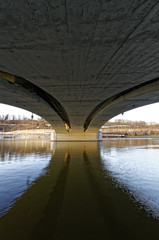 Shadow of a bridge in water