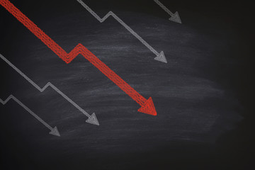 Decline in stocks on blackboard