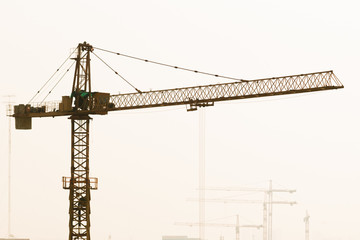 Heavy power crane working a construction.