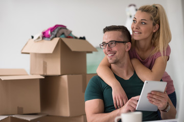 Young couple moving in a new home