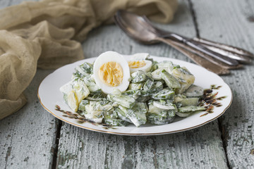 potato salad with egg, radishes and cucumbers
