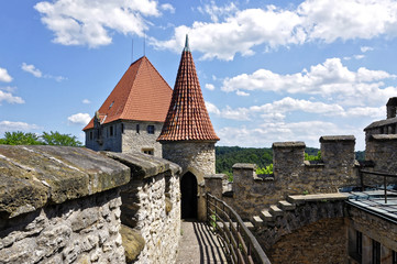 Cone shape monumental tower with red tiles roof