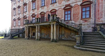 Woman standing in the front balcony