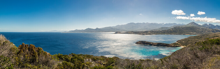 Fototapeta na wymiar Panoramic of Calvi citadel and mountains from Revellata in Corsica