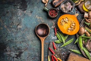 Thanksgiving seasonal cooking with Healthy and organic harvest vegetables and ingredients: pumpkin,...