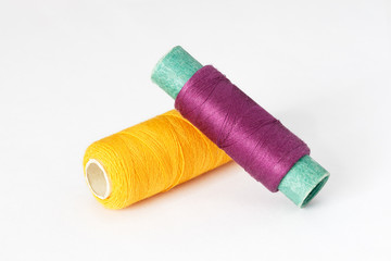 Two spools of thread