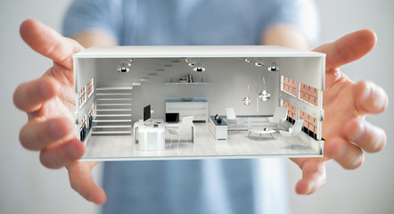 Businessman holding white 3D rendering apartment