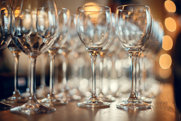 Close up picture of empty glasses on the wooden counter  in restaurant