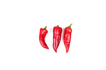 Three Red Peppers on White