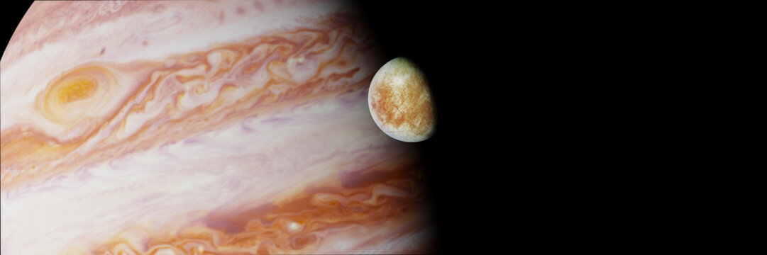 Jupiter's moon Europa in front of the planet Jupiter