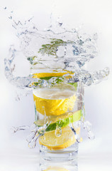 Lemons and limes in the glass. Concept and idea of drink