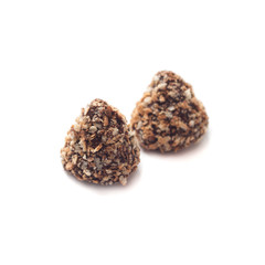 A couple of truffle chocolates in wafer crumbs isolated on a white background