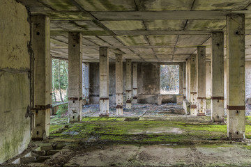 Halfly demoslished concrete building with pillars