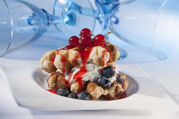 waffles with cream & Berries on white plate 