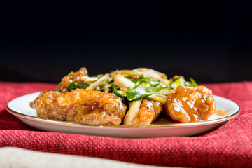 wok fried chicken stir fry with sweet peppers and chinese vegetables