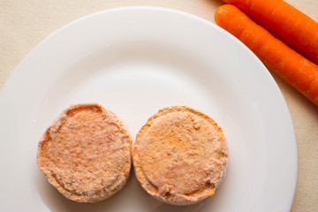 Carrot cutlets on a white plate. The concept of a healthy diet. Vegetarian cuisine.