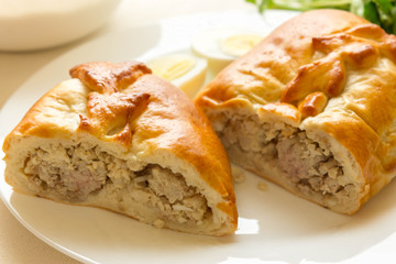 Meat pie with egg and vegetables. Nutritious and tasty dish.