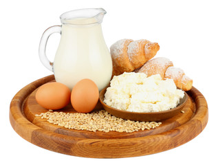 Glass jug pitcher of fresh milk with glass, eggs and cottage cheese isolated on white background carafe
