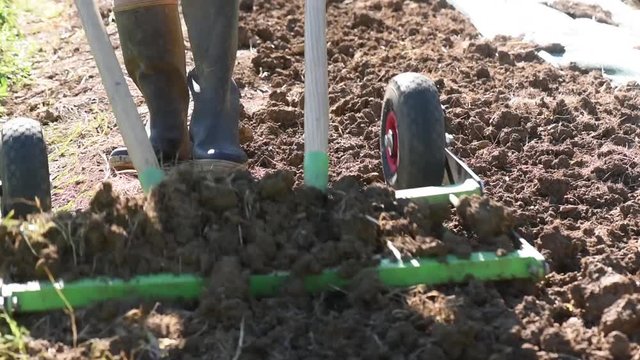 Person returns the earth from her organic garden