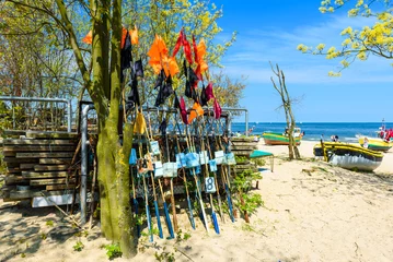 Acrylic prints The Baltic, Sopot, Poland Network fishing drying on the beach in sunny day. Baltic Sea and fishing boats in background. Sopot, Poland.