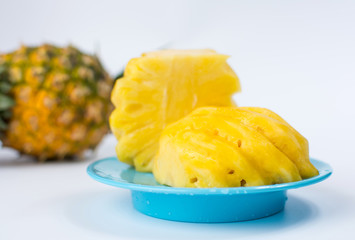 Peeled and sliced pineapple on a plate