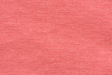 Red fabric canvas macro shot as texture or background