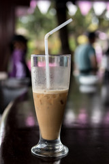 Iced coffee or caffe latte close up in pool bar. Bali island, Indonesia.