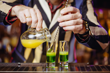 preparing a green Mexican cocktail