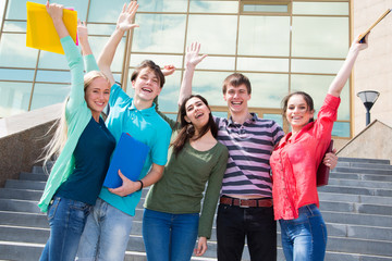 Happy students jumping for joy after the exam