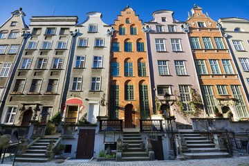 Burgher houses with entrance terraces and richly decorated facades on the Mariacka Street - one of the most beautiful streets of the Old Town of Gdańsk, Poland at sunrise © Mariusz Świtulski