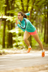 Fitness woman running and jogging at park