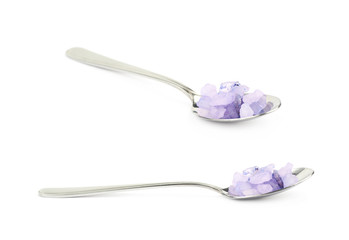 Spoon full of salt crystals isolated