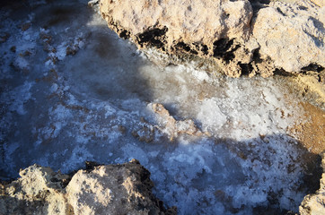 dry sea salt on the rocky background
