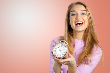 Businesswoman holds alarm clock