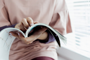 woman reading a magazine