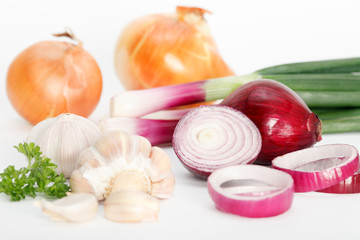 Garlic and onion vegetables with parsley on white background