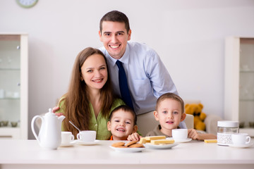 Obraz na płótnie Canvas Happy family having breakfast together at home