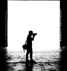 silhouette of a photographer man