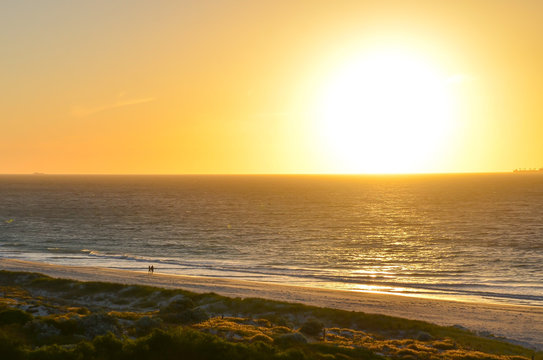 lovers walking on the twilight beach