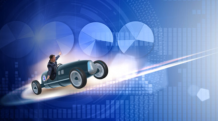 Businessman riding sports car against charts
