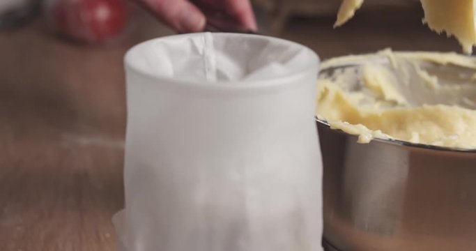 Slide shot of adding dough into pastry bag, 4k 60fps prores footage