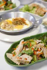 Preserved pork sausage spicy salad on white background. Food Thailand