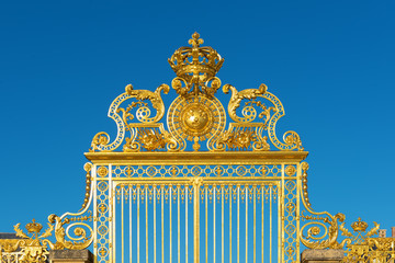 Detail of the golden Versailles palace gate entrance, France.