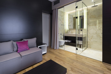 Interior of a hotel bedroom with bathroom