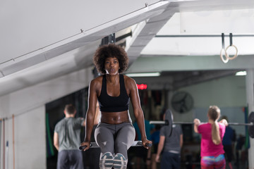 black woman doing parallel bars Exercise