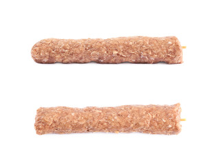 Raw kebab meat on a stick